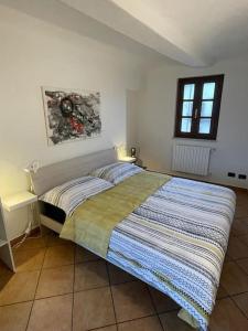 מיטה או מיטות בחדר ב-Casa San Pietro centro storico