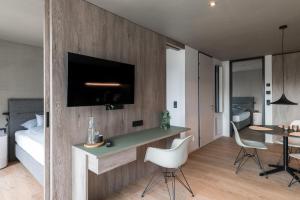 A television and/or entertainment centre at Livingreen Residences