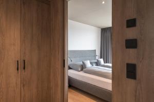Ένα ή περισσότερα κρεβάτια σε δωμάτιο στο Livingreen Residences