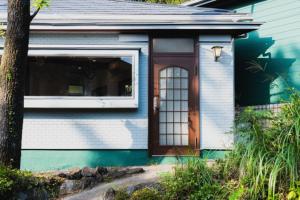 a house with a door and a window at Izukogen tent resort - Vacation STAY 13377v in Ito