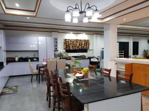 a kitchen and dining room with a table and chairs at Yuke's Bed & Breakfast in Valencia