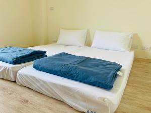 Postel nebo postele na pokoji v ubytování Wind Island B&B