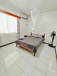 Postel nebo postele na pokoji v ubytování Coconut Bay Apartments