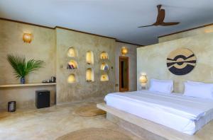 Postel nebo postele na pokoji v ubytování Safaya Luxury Villas - Adults only