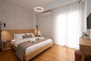 Posteľ alebo postele v izbe v ubytovaní Deluxe 4 Bedrooms Apartment in Athens Center