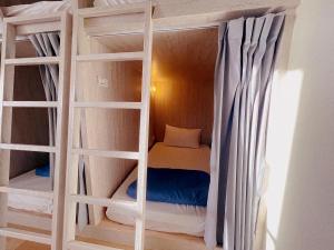 Postel nebo postele na pokoji v ubytování Wind Island B&B