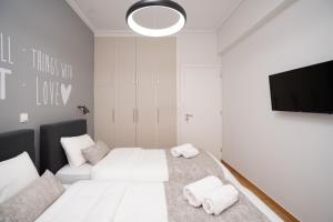 Posteľ alebo postele v izbe v ubytovaní Deluxe 4 Bedrooms Apartment in Athens Center