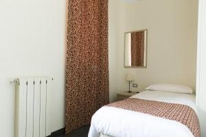 Postel nebo postele na pokoji v ubytování Hotel Casa Valdese Roma