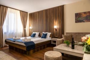 A bed or beds in a room at Beluga Guest House
