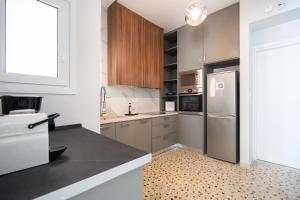 Kuchyňa alebo kuchynka v ubytovaní Deluxe 4 Bedrooms Apartment in Athens Center