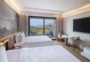 Postel nebo postele na pokoji v ubytování JW Marriott Goa + 37 fotografií