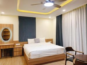 Giường trong phòng chung tại Cam Hotel Phu Quoc