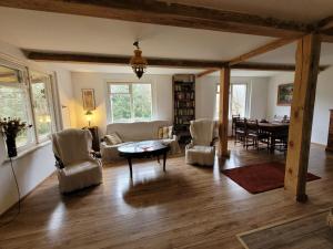 a living room with a table and chairs at Buglandia in Parośla +40 photos