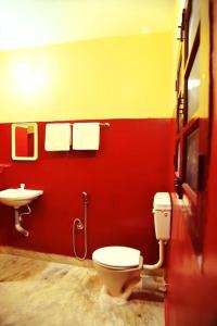a bathroom with a toilet and a sink at Smith 5BHK Villa in Puducherry