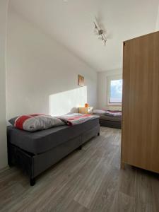 a bedroom with two beds in a room at Gästewohnung KL WZL 31 8 