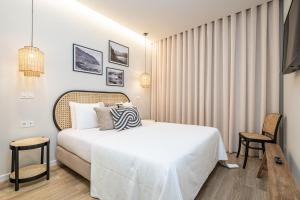 Giường trong phòng chung tại Machim D Arfet House by Homie