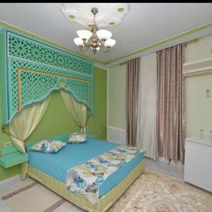 Кровать или кровати в номере Maison D'hôte Dar Saida