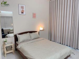 Postel nebo postele na pokoji v ubytování Vgreen Home