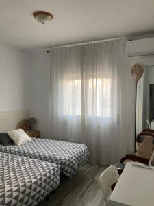 Postel nebo postele na pokoji v ubytování Apartament ca l'Irene
