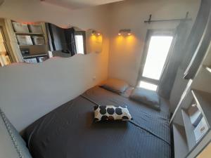 Posteľ alebo postele v izbe v ubytovaní Appartement Village Naturiste Dunes