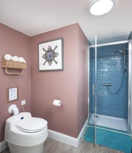 a bathroom with a toilet and a shower at The Dome at Mid Auchengowan in Lochwinnoch