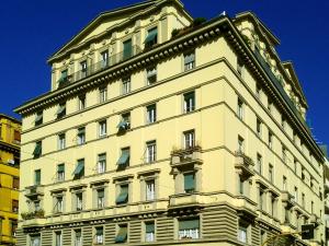 a tall white building with at Passenger Vatican Relais in Rome