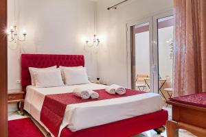 A bed or beds in a room at Dimitra Mare