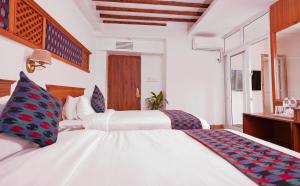 Postel nebo postele na pokoji v ubytování Himalayan Glory Inn