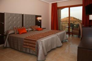 En eller flere senge i et værelse på Hotel Rural Quinto Cecilio