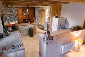 an aerial view of a kitchen with a refrigerator at Gîte ferme en permaculture avec ses animaux in Sixt