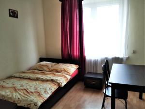 Łóżko lub łóżka w pokoju w obiekcie Hostel Omega