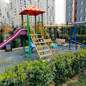 a playground in a park with a slide at Home in love in Esenyurt