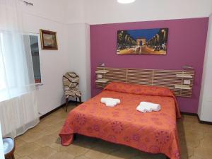 Postel nebo postele na pokoji v ubytování Rooms Palazzo Paladini