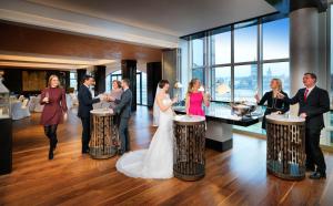 a bride and groom and their wedding party at Hyatt Regency Köln in Cologne