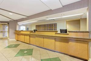 a large waiting room with a bar in a hospital at La Quinta by Wyndham Orlando I Drive/Conv Center in Orlando