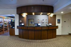 a lobby with a reception counter in a store at Comfort Inn Gold Coast in Ocean City