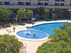 The swimming pool at or close to ApartUP Patacona Orchard Views
