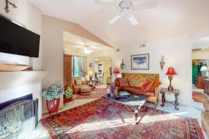 a living room with a couch and a fireplace at Antique Retreat in Scottsdale