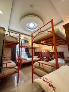 a group of bunk beds in a room at Ha Long Starlight Hostel in Ha Long