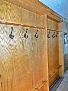 a wooden wall with four pairs of paddles on it at ML246 Spacious Condo Mtn & Lake views fireplace in Snowshoe