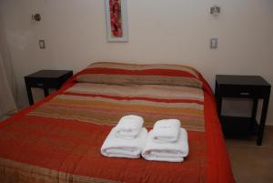 Una cama o camas en una habitación de Hotel Parador Ruta 40