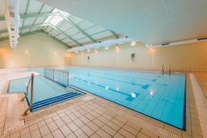 a large indoor swimming pool with a large pool at Castlerosse Park Resort in Killarney