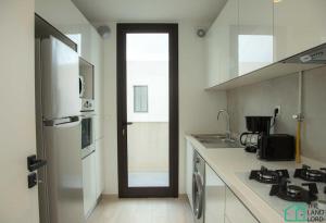 Η κουζίνα ή μικρή κουζίνα στο A22 Cozy and central at La Marsa