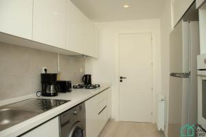 Η κουζίνα ή μικρή κουζίνα στο A22 Cozy and central at La Marsa