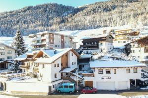 a small town in the snow with houses at Haus Otto Arnold in Sölden