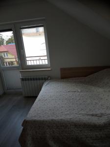 Posteľ alebo postele v izbe v ubytovaní Pokoje Goscinne TOMASZ