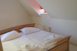 Ein Bett oder Betten in einem Zimmer der Unterkunft Hotel Petr