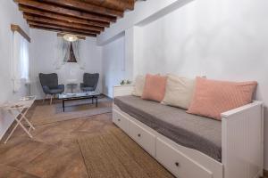 a bedroom with a bed and a table and chairs at Casa Aestas in Lachania