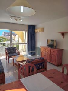 Телевизор и/или развлекательный центр в Apartamentos Moguima