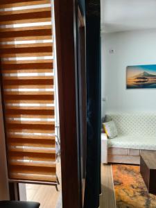 Tempat tidur dalam kamar di Apartmani Gavric Borovi 2